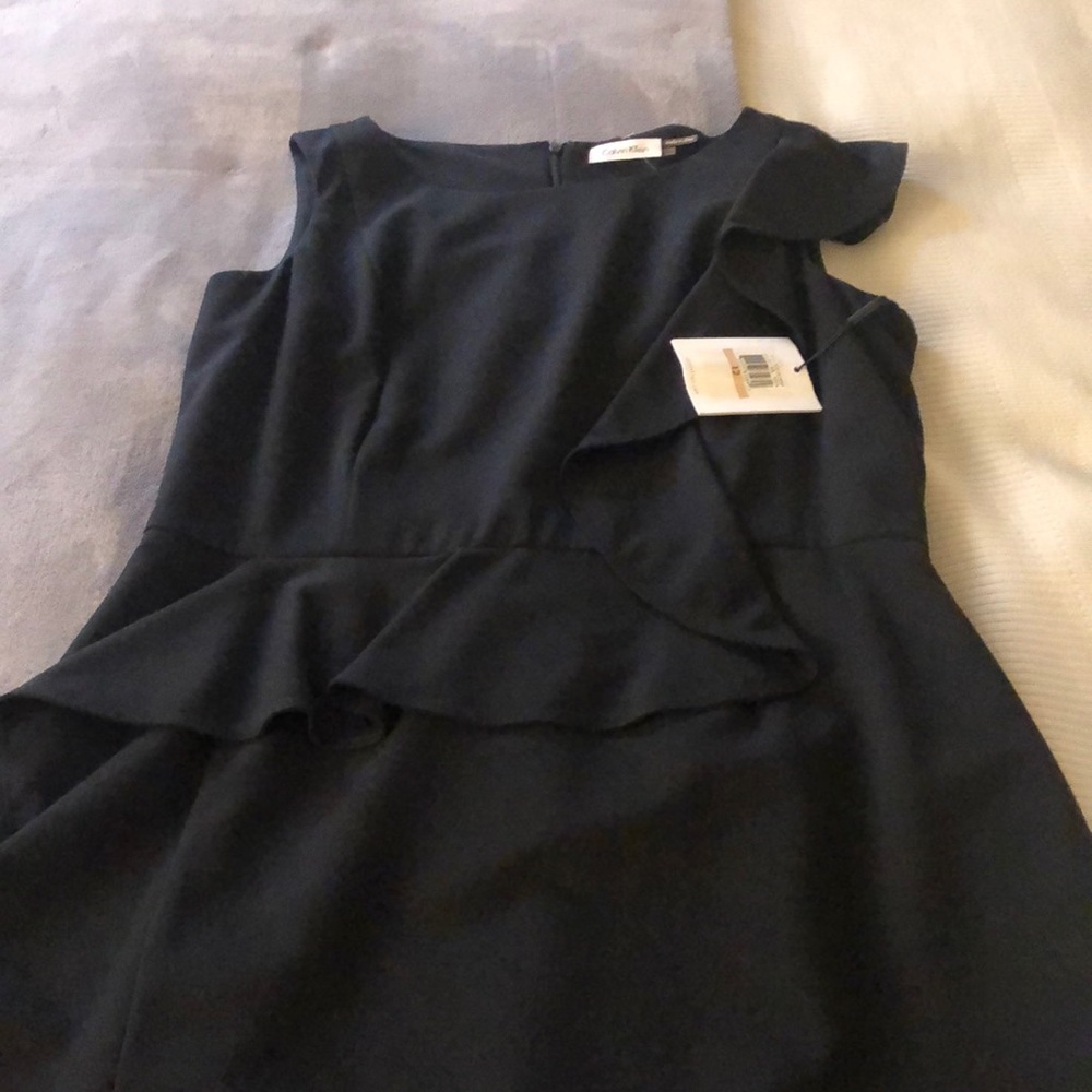 Calvin Klein, New with to tags black dress. Size 12